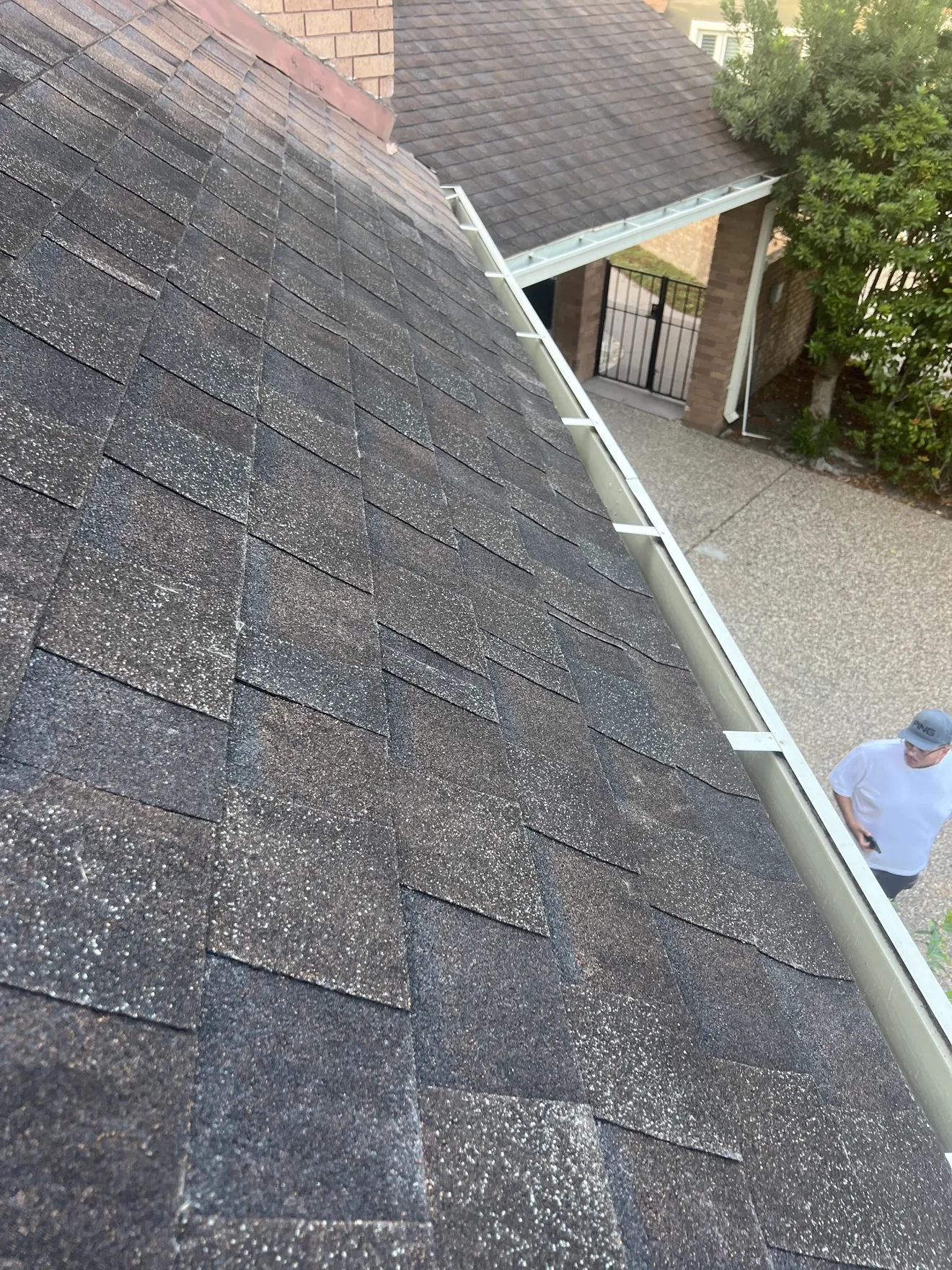 Finished shingle slope with new gutter