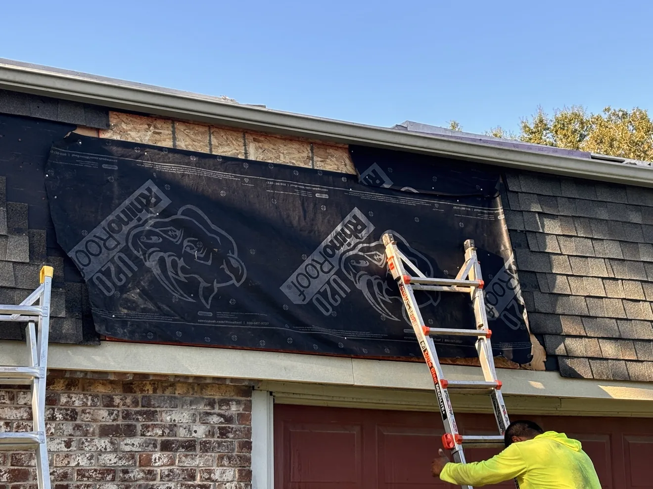 Synthetic underlayment laid over repaired roof decking